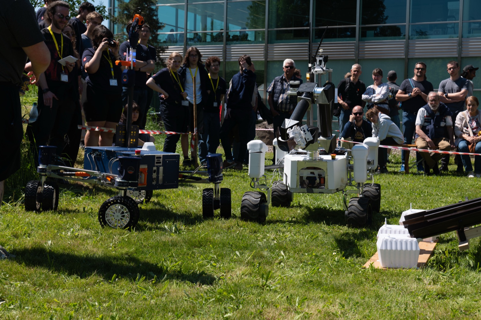 two competitor rovers cooperating on the team task