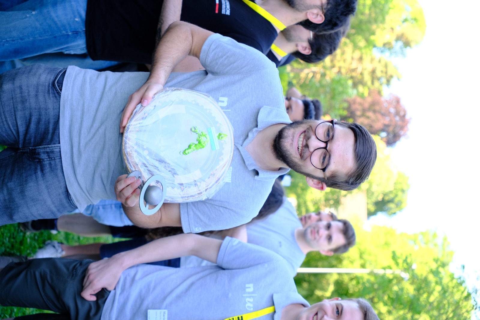FHNW Rover Team holding the trophy and the 6kg of Swiss cheese we won for first place
